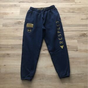 Under Armour Project Rock Loose Fit Cold Gear Navy Joggers with Gold Accents